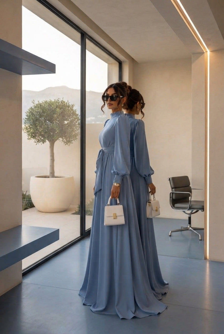 A professional stands in a bright, modern architectural space with slate blue and cream accents, representing durability and 